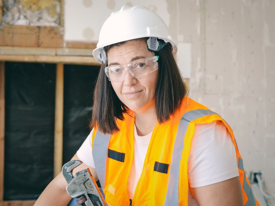 Professional plumber holding a pipe wrench in Prescott, Arizona
