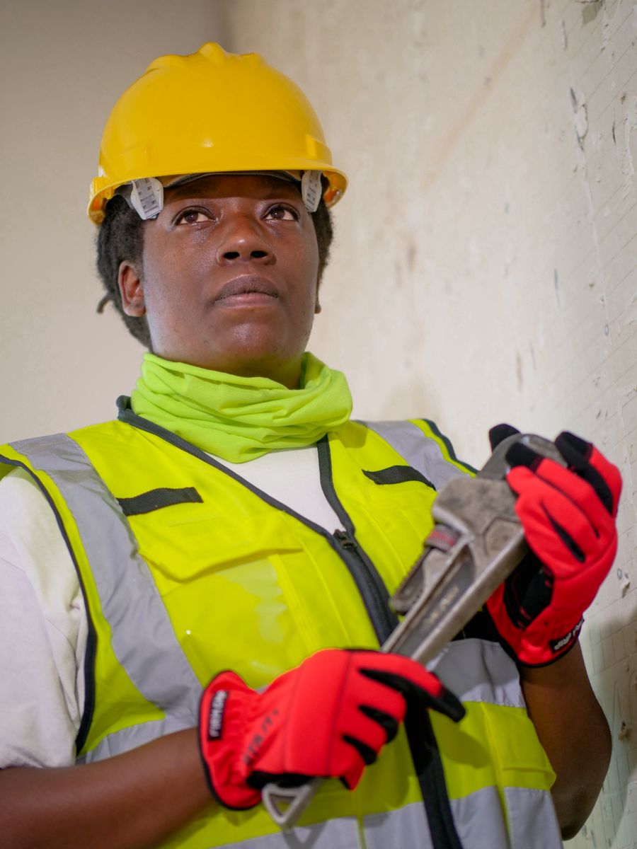 Plumbing professional with pipe wrench ready for service in Prescott, AZ