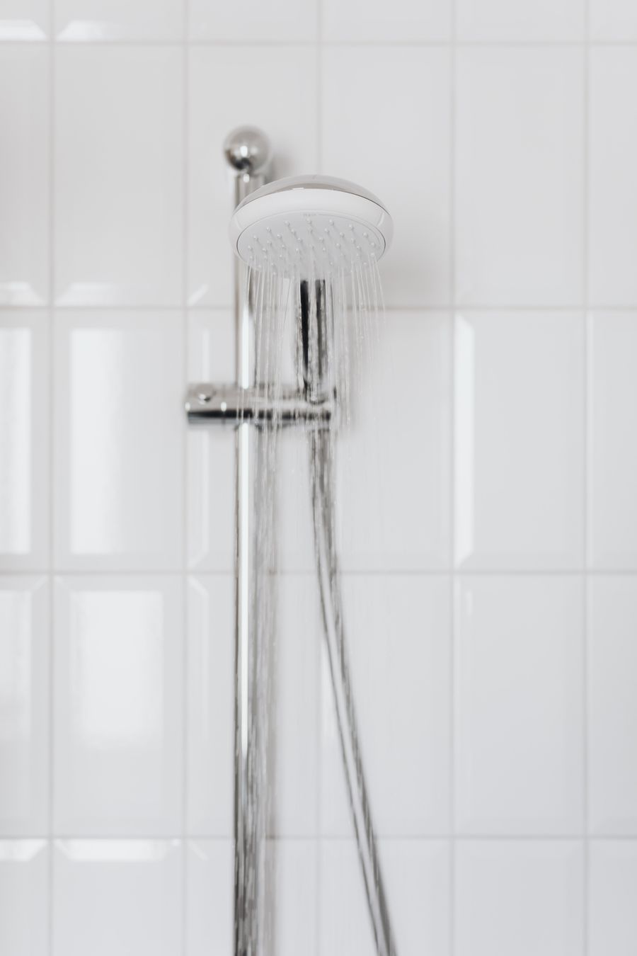 Shower head with running water in a Prescott, AZ bathroom